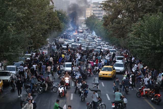 Demonstrators take to the streets of the capital Tehran in September last year, following the death of Mahsa Amini in police custody (Picture: AFP via Getty Images)