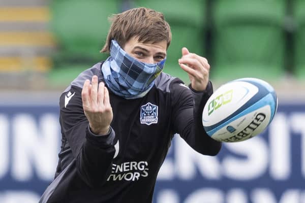 Glasgow Warriors wing Sebastian Cancelliere dons a tartan snood during a training session at Scotstoun. (Photo by Ross MacDonald / SNS Group)