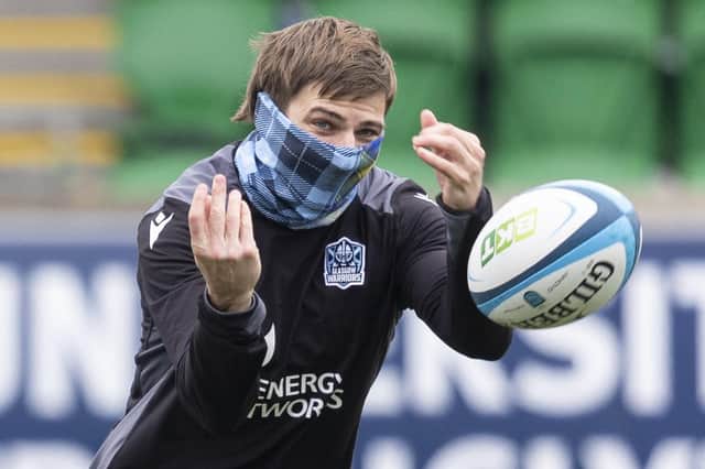 Glasgow Warriors wing Sebastian Cancelliere dons a tartan snood during a training session at Scotstoun. (Photo by Ross MacDonald / SNS Group)