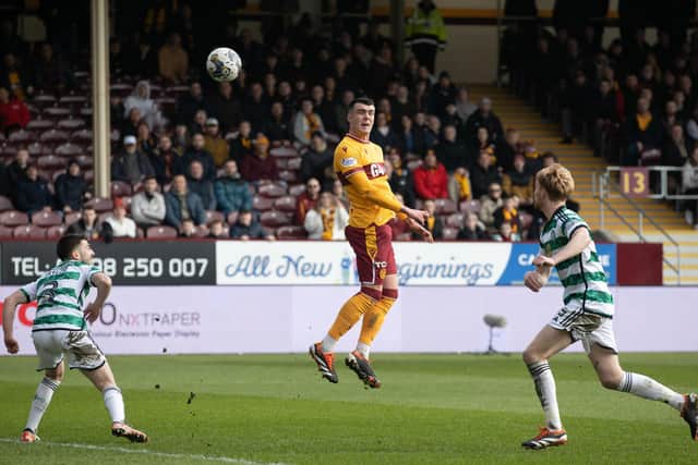 Lennon Miller rises to meet a cross during Motherwell's 3-1 defeat by Celtic. The 17-year-old was an impressive performer.