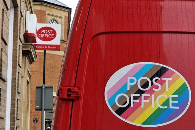 A Post Office van in front of an existing outlet