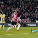 Southampton's Che Adams puts the ball past Preston North End goalkeeper Freddie Woodman to score his second goal of the game in Tuesday's 3-0 win at St Mary's.