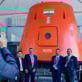 Visitors click photographs in front of a model of 'Gaganyaan' orbital module developed by Indian Space Research Organisation (ISRO) for its planned 'Man in Space' mission.