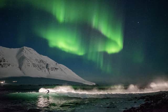 Surfing under the Northern Lights in Iceland PIC: Chris Burkard