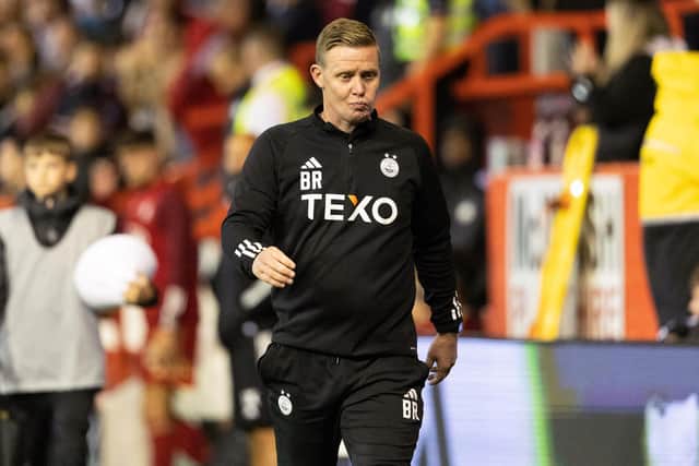 Aberdeen manager Barry Robson looks on at full time following the defeat by BK Hacken.