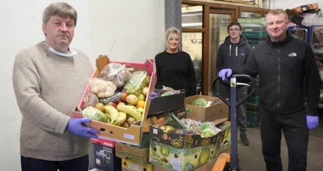 Wholesaler Vincent McGowan with his team. Picture: SWNS