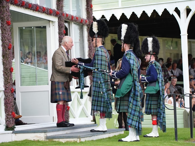 King Charles III presenting awards during the Braemar Gathering