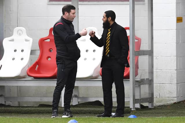 Brechin City manager Andy Kirk and Iftikhar share a fist bump.