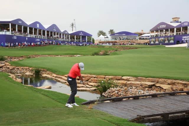Rory McIlroy plays his third shot on the 18th hole during day one of the DP World Tour Championship on the Earth Course at Jumeirah Golf Estates in Dubai. Picture: Andrew Redington/Getty Images.