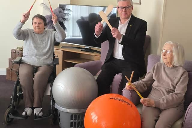 Stuart McMillan, Member of Scottish Parliament (MSP) for Greenock and Inverclyde with residents at HC-One Scotland’s Merino Court Care Home celebrating Care Home Open Week 2025