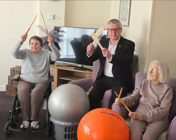 Stuart McMillan, Member of Scottish Parliament (MSP) for Greenock and Inverclyde with residents at HC-One Scotland’s Merino Court Care Home celebrating Care Home Open Week 2025