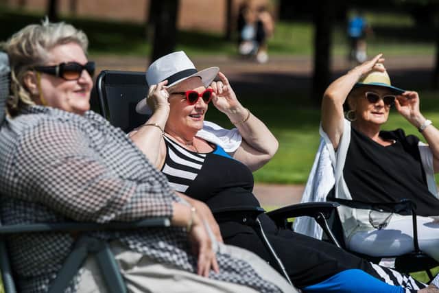 Glaswegians enjoy the sun today as temperatures rise in the city.