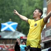 Scotland fans gather in Leicester Square before the UEFA Euro 2020 match between England and Scotland later tonight.