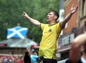 Scotland fans gather in Leicester Square before the UEFA Euro 2020 match between England and Scotland later tonight.