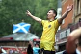 Scotland fans gather in Leicester Square before the UEFA Euro 2020 match between England and Scotland later tonight.