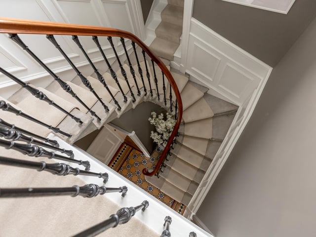 The stairs lead to a galleried landing