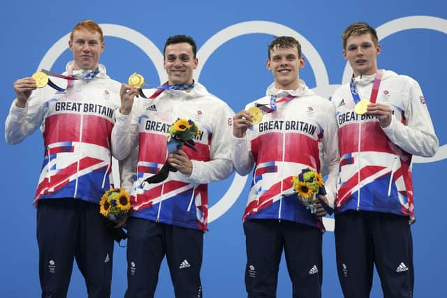 Britain's men's 4x200-metres relay team with their Olympic gold medals. From left, Tom Dean, James Guy, Matthew Richards, and Duncan Scott. Picture: Matthias Schrader/AP