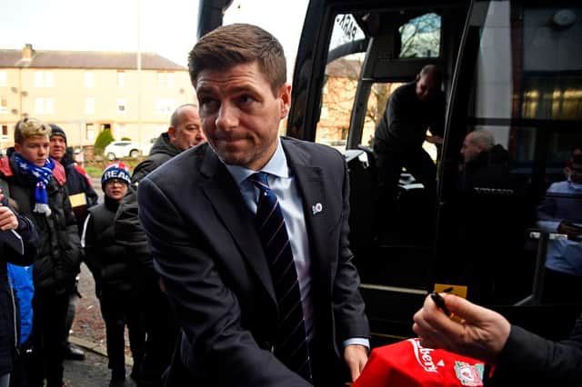 Rangers manager Steven Gerrard signs a Liverpool shirt upon arriving at Dens Park for a game against Dundee in December 2018
