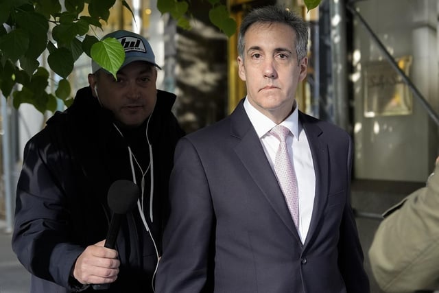 Michael Cohen leaves his apartment building on his way to Manhattan criminal court on Monday. Photo: AP Photo/Julia Nikhinson