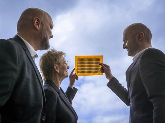 From left: Alastair McMillen of the SNIB, Niki McKenzie of Archangels, and Jean Christophe-Granier of iGii with a sheet of Gii-Sens. Picture: Phil Wilkinson.