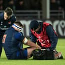 Edinburgh prop Robin Hislop receives treatment after his injury against Gloucester.