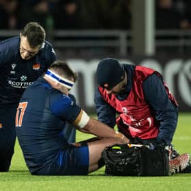 Edinburgh prop Robin Hislop receives treatment after his injury against Gloucester.