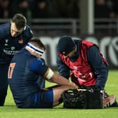 Edinburgh prop Robin Hislop receives treatment after his injury against Gloucester.