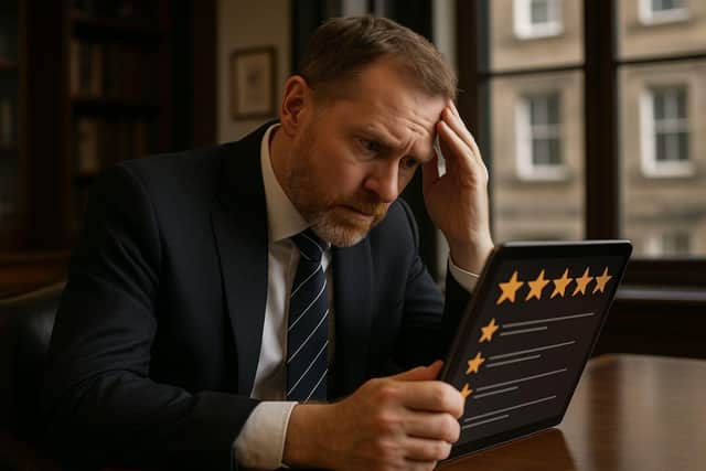 A Scottish business owner reviews online feedback, representing firms across Scotland from Edinburgh to Glasgow facing growing threats from fake reviews, with new legislation imposing fines of up to £300,000 for review manipulation.