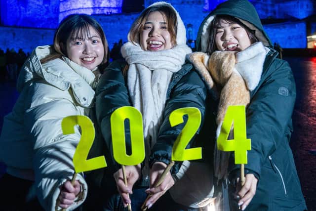 University students from Japan during Edinburgh''s Hogmanay celebrations. Picture: Jane Barlow/PA Wire