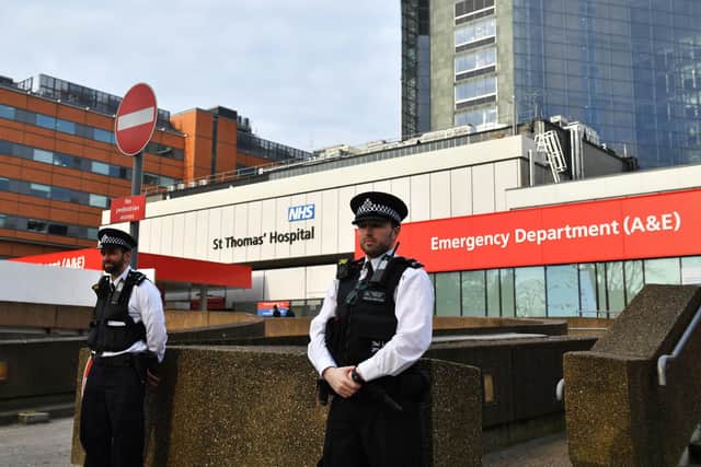 Police officers outside St Thomas' Hospital in Central London, where Prime Minister Boris Johnson remains in intensive care as his coronavirus symptoms persist