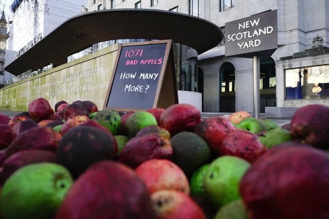 1,071 rotten apples outside New Scotland Yard, reflecting the number of Metropolitan Police officers who have been, or are currently, under investigation