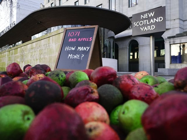 1,071 rotten apples outside New Scotland Yard, reflecting the number of Metropolitan Police officers who have been, or are currently, under investigation