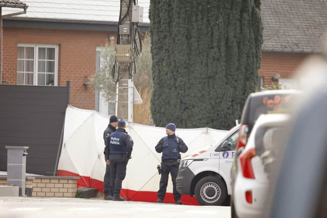 Police secure the area after an incident at a carnival, in Strepy-Bracquenies, Belgium, Sunday, March 20, 2022. A car slammed at high speed into carnival revelers in a small town in southern Belgium, killing six people and leaving 10 more with life threatening injuries. (AP Photo/Olivier Matthys)