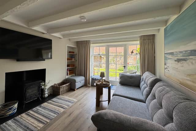 Fisherman cottage living area leading to garden