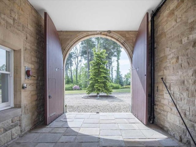Carriage arch entrance to courtyard.