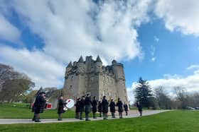 Drums & Pipes of The Gordon Highlanders Association Pipe Band lead the procession to Castle Fraser (NTS)