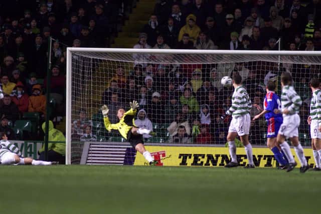 Celtic goalkeeper Jonathan Gould is beaten by an Inverness strike.