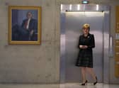 First Minister Nicola Sturgeon waits on a lift at the Scottish Parliament in Edinburgh