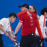 Bruce Mouat and Jennifer Dodds celebrate a win against China during the curling mixed doubles at the Beijing 2022 Winter Olympics. (Photo by Lintao Zhang/Getty Images)