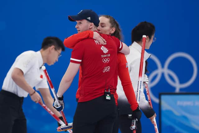 Bruce Mouat and Jennifer Dodds celebrate a win against China during the curling mixed doubles at the Beijing 2022 Winter Olympics. (Photo by Lintao Zhang/Getty Images)