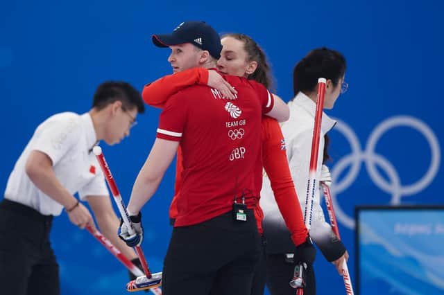Bruce Mouat and Jennifer Dodds celebrate a win against China during the curling mixed doubles at the Beijing 2022 Winter Olympics. (Photo by Lintao Zhang/Getty Images)
