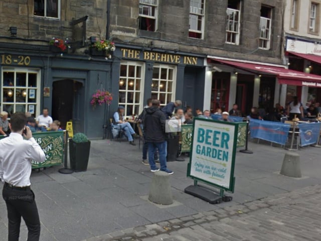 The Beehive Inn in Edinburgh's Grassmarket is said to be haunted by several ghosts, one of which is the apparition of a young woman who appears in various rooms.