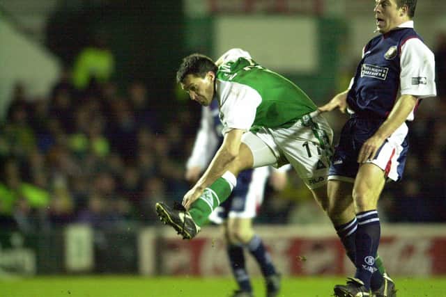 Pat McGinlay in typically rumbustious form for Hibs against Dundee in 2000.