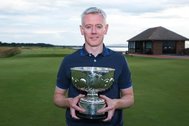 Malcolm Macleman shows off the trophy after his first title triumph in the Nairn men's championship. Picture: Nairn Golf Club