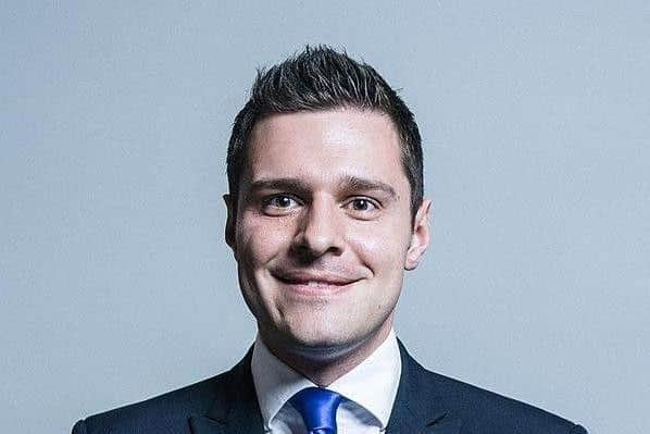 A man has been charged with making threatening comments online to former Scottish Conservative MP Ross Thomson.