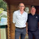 At one of the park's luxury lodges are (from left) John Lamont MP, park manager Scott