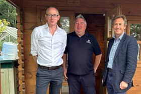 At one of the park's luxury lodges are (from left) John Lamont MP, park manager Scott
