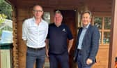 At one of the park's luxury lodges are (from left) John Lamont MP, park manager Scott