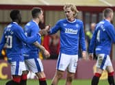 Todd Cantwell celebrates with Fashion Sakala after putting Rangers 3-2 ahead at Motherwell. (Photo by Rob Casey / SNS Group)