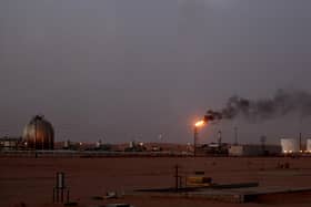 A flame sends smoke billowing into the sky at a Saudi Aramco oil installation in Al-Khurais, Saudi Arabia (Picture: Marwan Naamani/AFP via Getty Images)